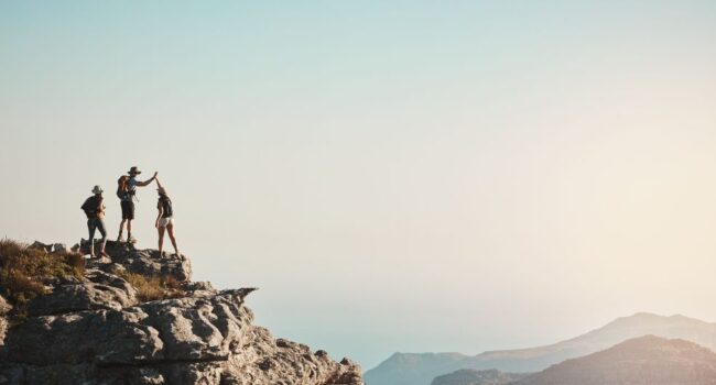 people on top of mountain people on top of mountain
